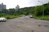 Look right past parking lot toward forested area below residential area