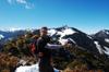 Mike at the peak of Chiyou mtn 池有山 3239m in front of Pintian Mtn 品田山