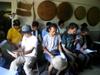 Inside farmhouse we gather to sing before orientation and work