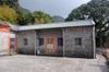 Building with new roof - traditional clay tile roofers are hard to come by