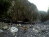 next photo: silt wall at the cave entrance