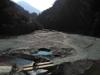 locals cross the river to go up to the forest road