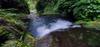 Leigh colling off in the stream below our camp on the bridge