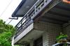 next photo: balcony roof rainwater drains into the air